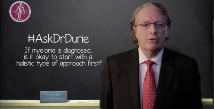 Dr. Durie headshot in front of chalk board