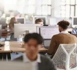 people working on computers in an office