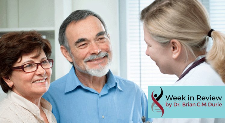 Doctor talks to smiling couple