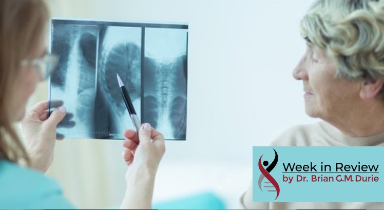 Doctor showing a scan to a elderly woman patient