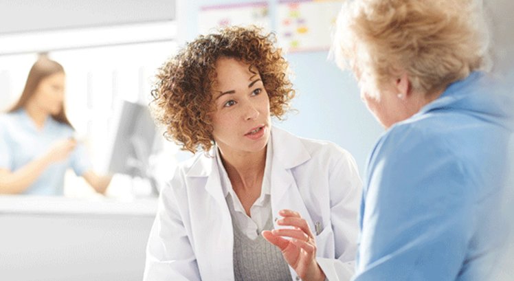 Doctor speaks to patient