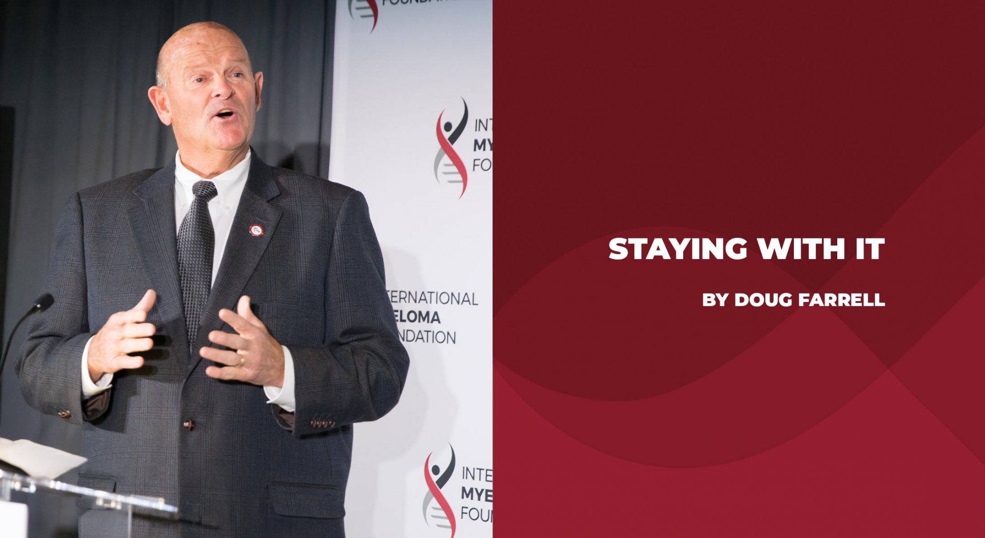 Multiple myeloma patient Doug Farrell at a podium