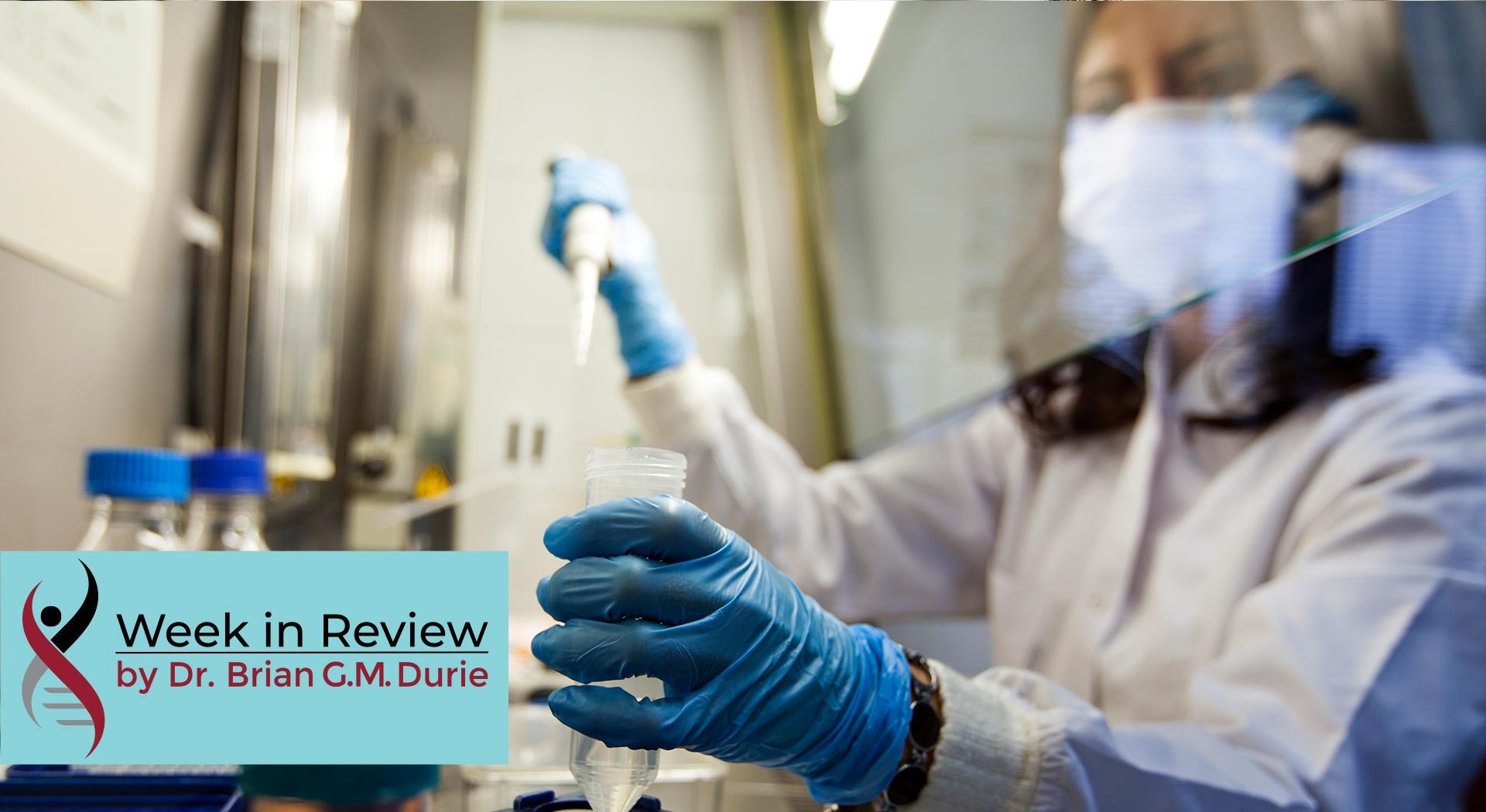 female scientist in laboratory gloved with mask