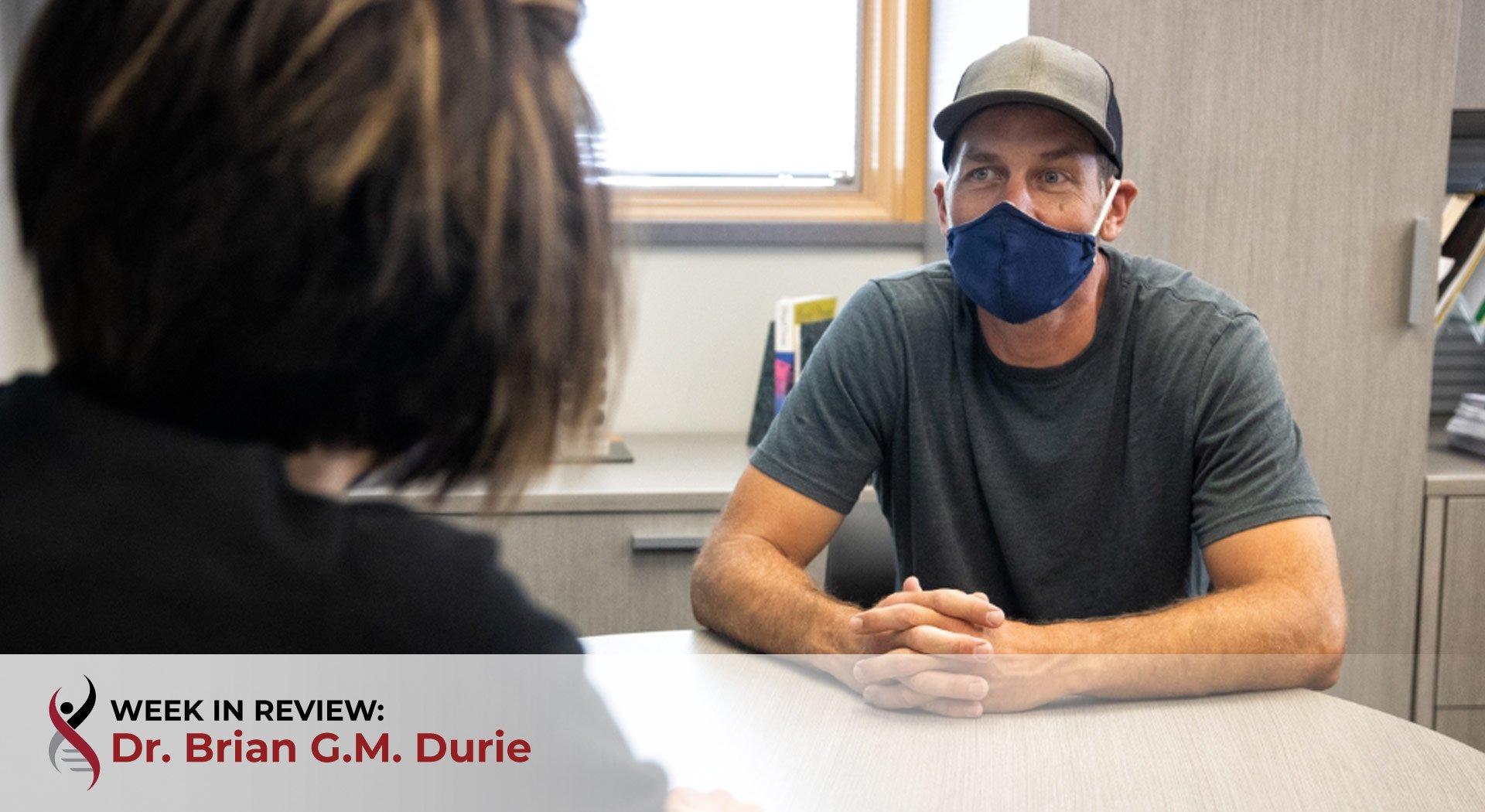 Health care worker with patient in mask