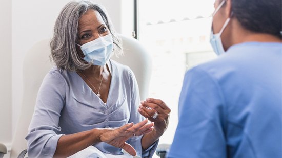 Elderly African American Patient with Doctor