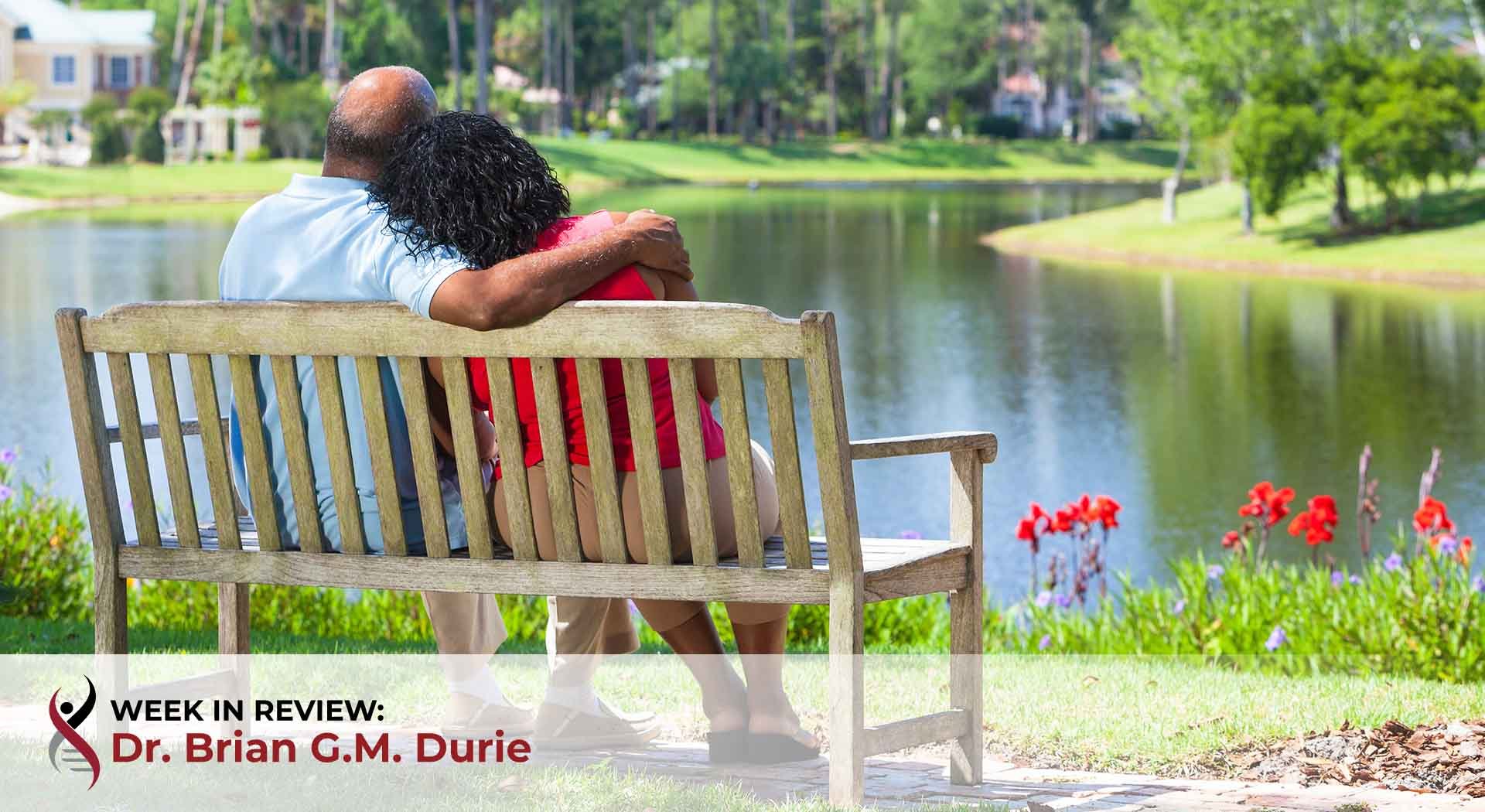 African American couple together on bench