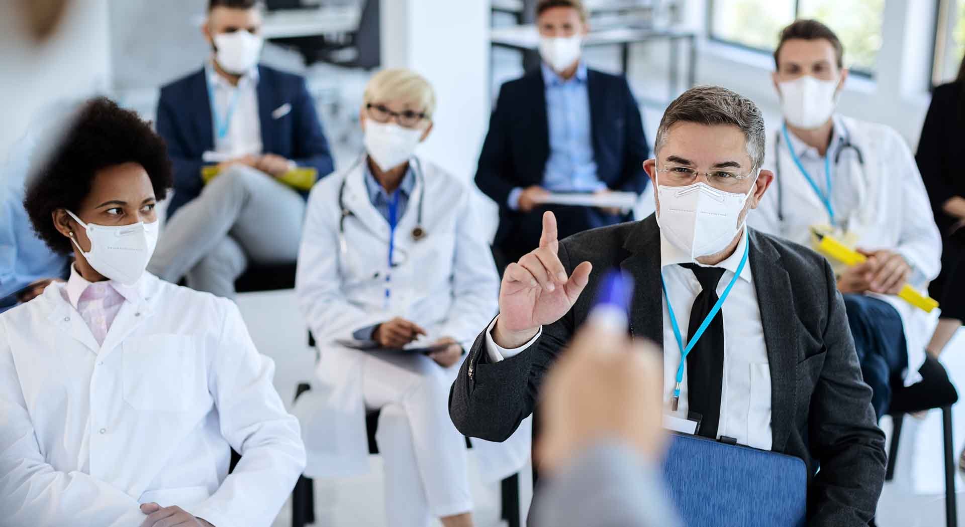Doctors and nurses in a seminar wearing masks