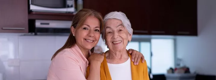 Senior and daughter preparing a meal