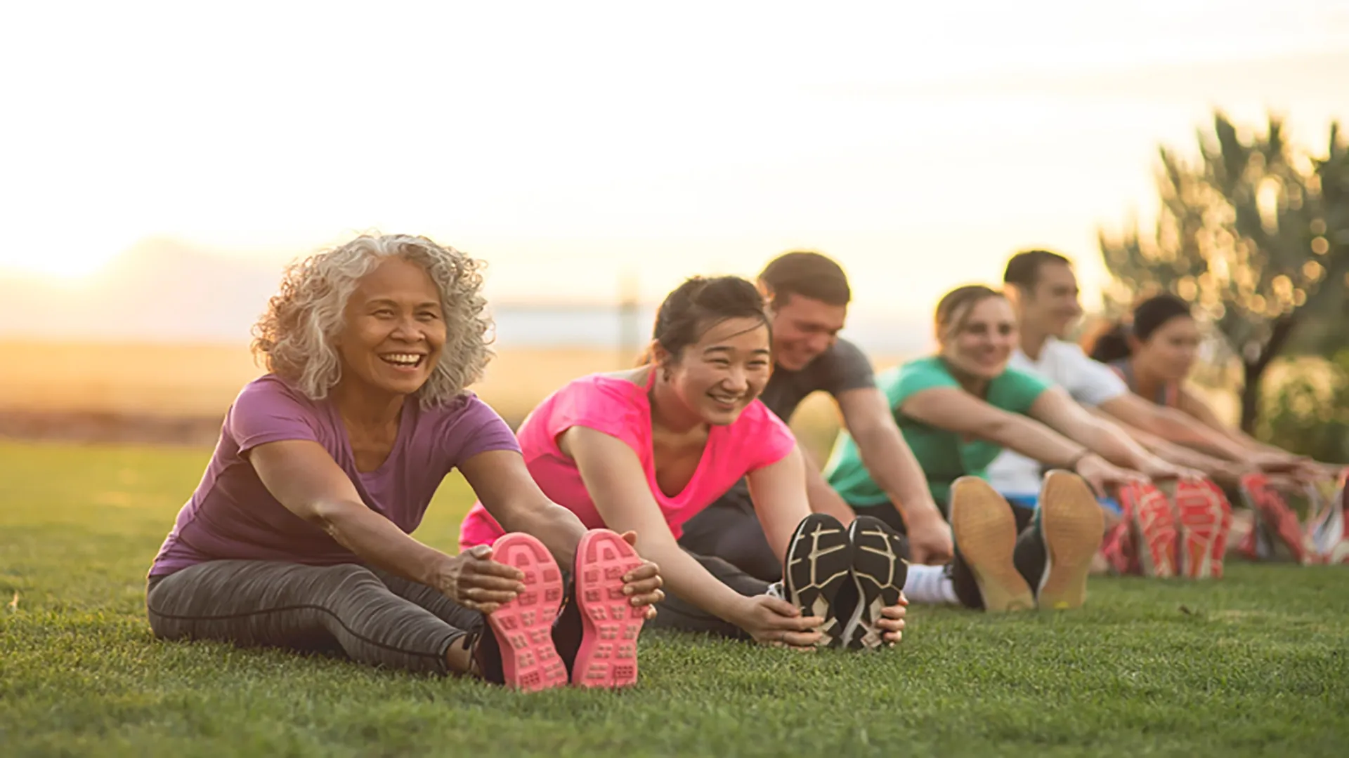people on grass stretching