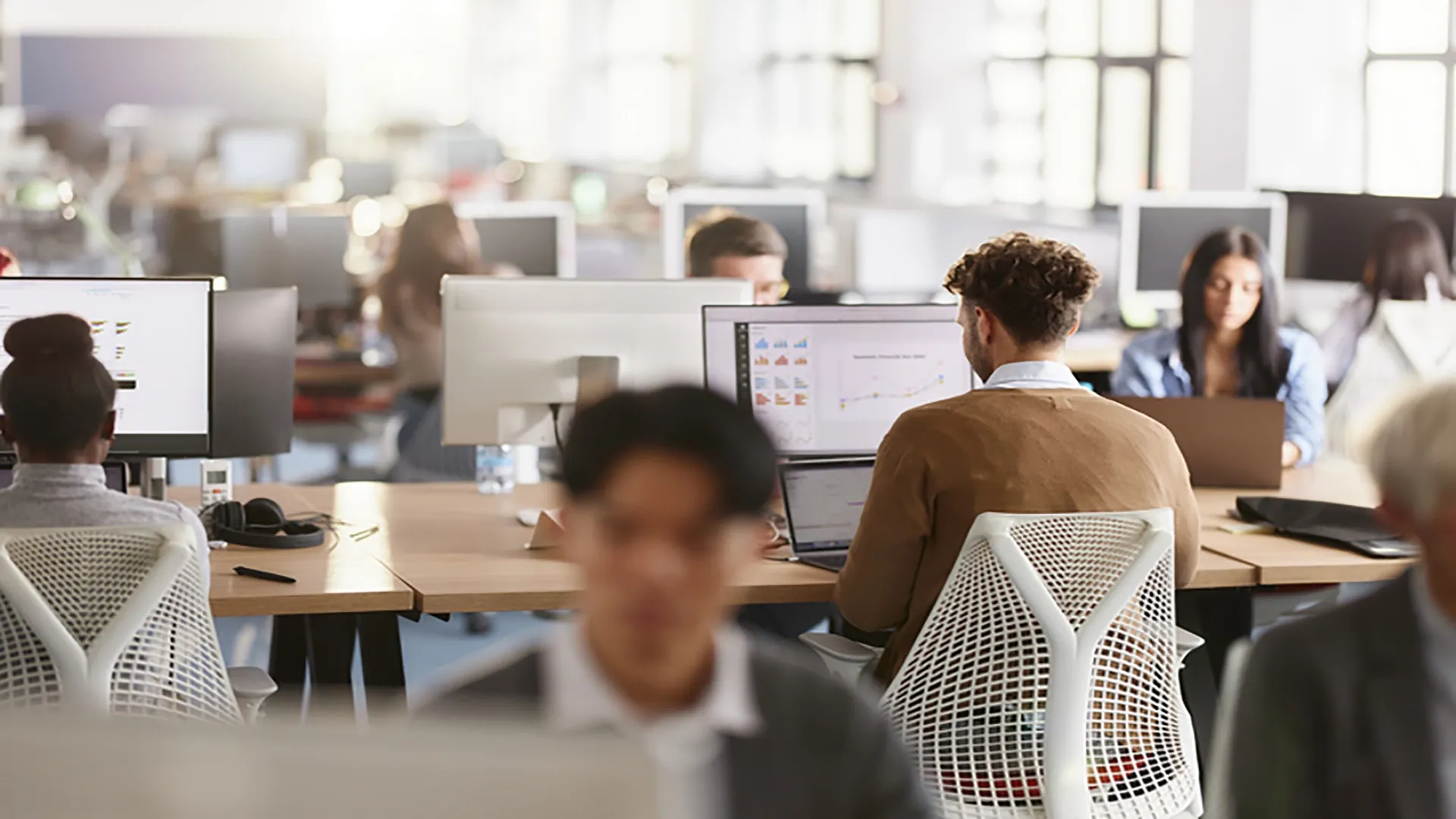 people working on computers in an office