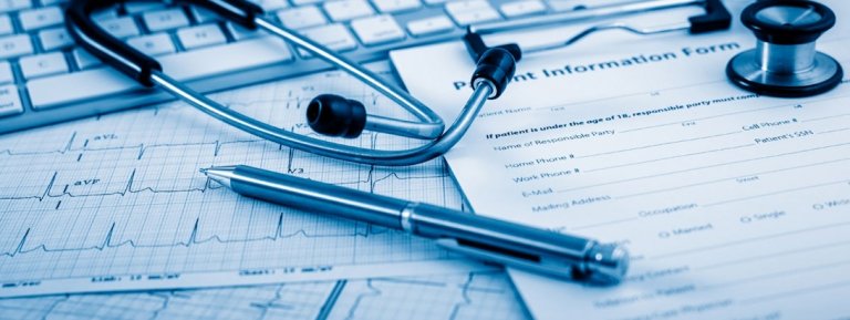 medical charts with pen and stethoscope