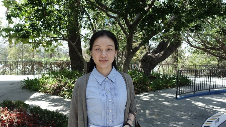 Image of Dr. Shenmiao Yang in front of a forest. 