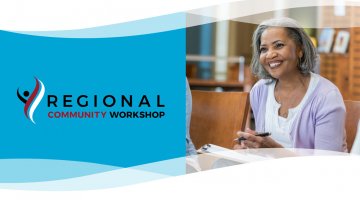 elderly woman smiling and taking notes in meeting
