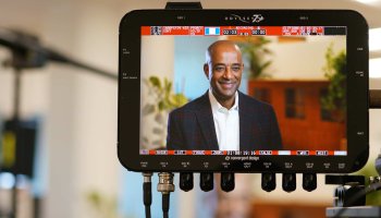 IMF CEO Yelak Biru on video monitor screen