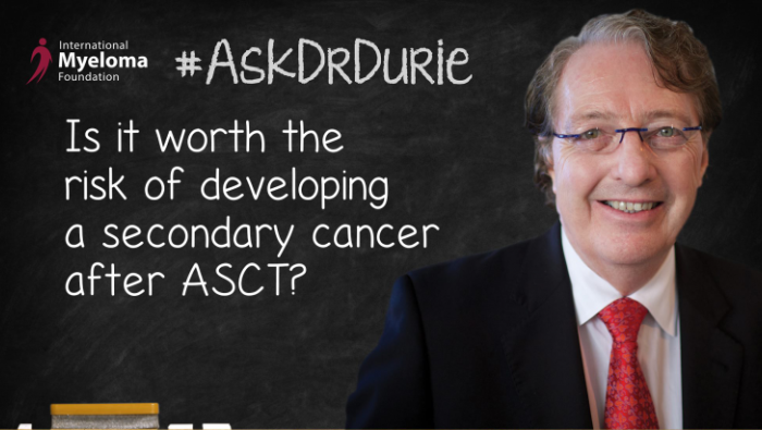 Dr. Durie in front of a chalk board