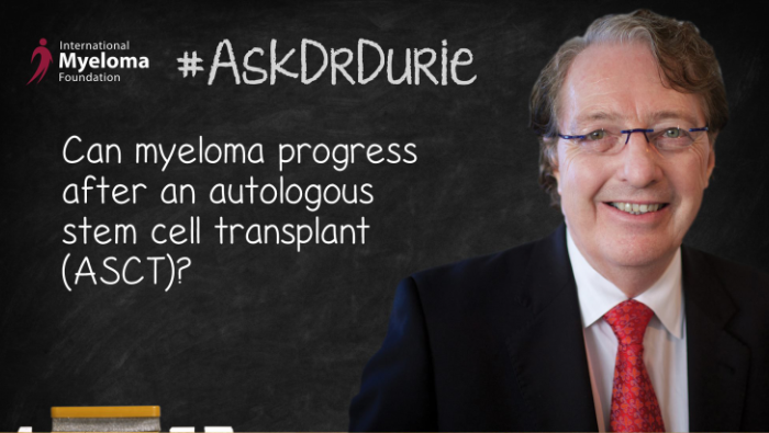 Dr. Durie in front of a chalk board