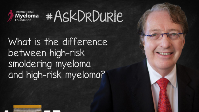 Dr. Durie in front of a chalk board