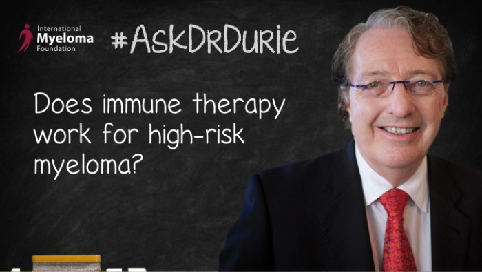 Dr. Durie in front of a chalk board
