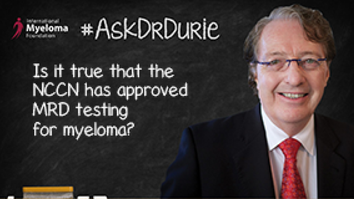 Dr. Durie in fornt of a chalk board