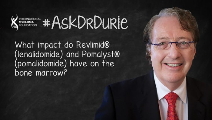 Dr. Durie in front of chalk board
