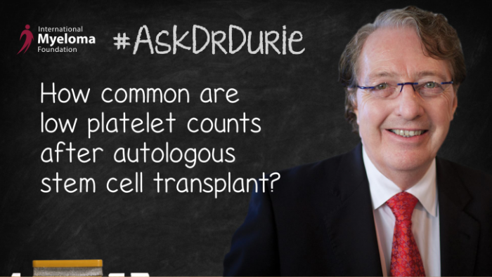Dr. Durie in front of a chalk board