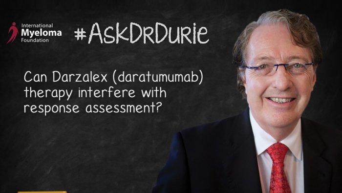Dr. Durie in front of a chalk board