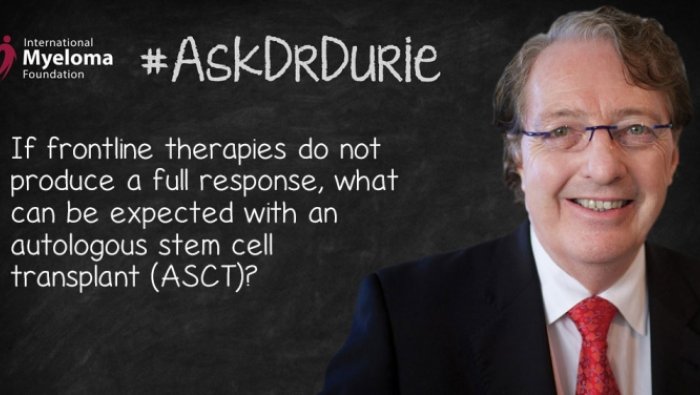 Dr. Durie in front of a chalk board