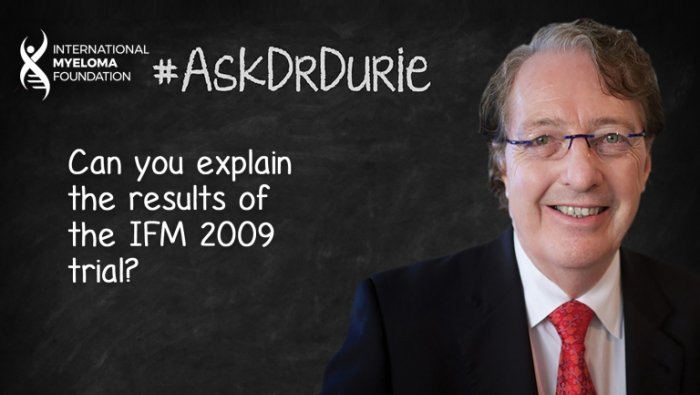 Dr. Durie in front of a chalk board