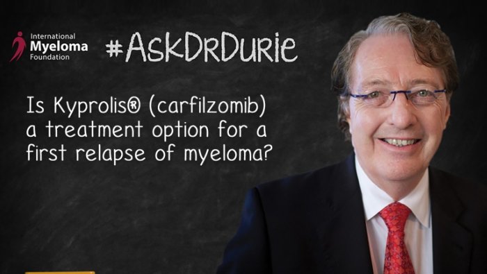 Dr. Durie in front of a chalk board