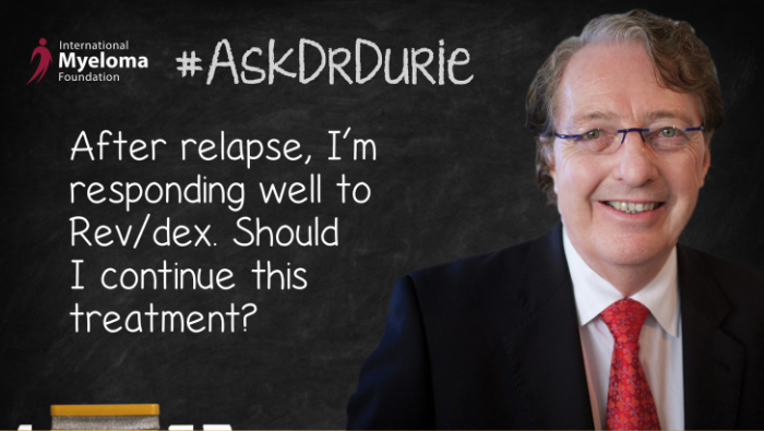 Dr. Durie in front of a chalk board