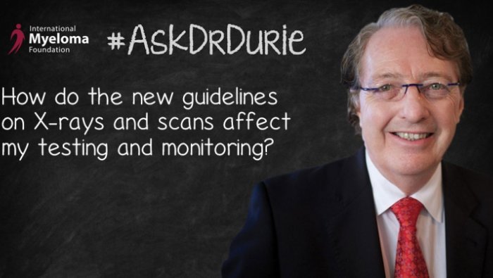 Dr. Durie in front of a chalk board