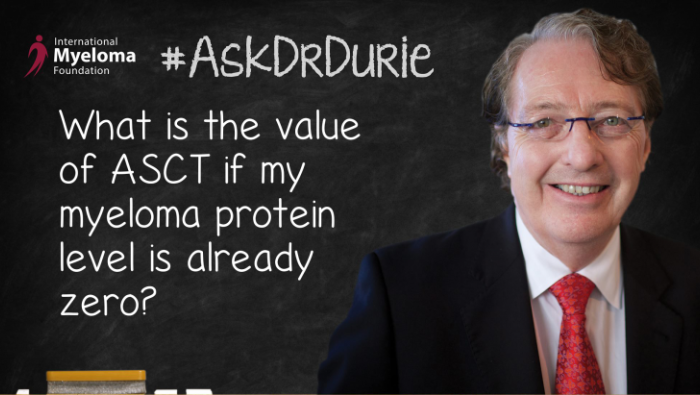 Dr. Durie in front of a chalk board