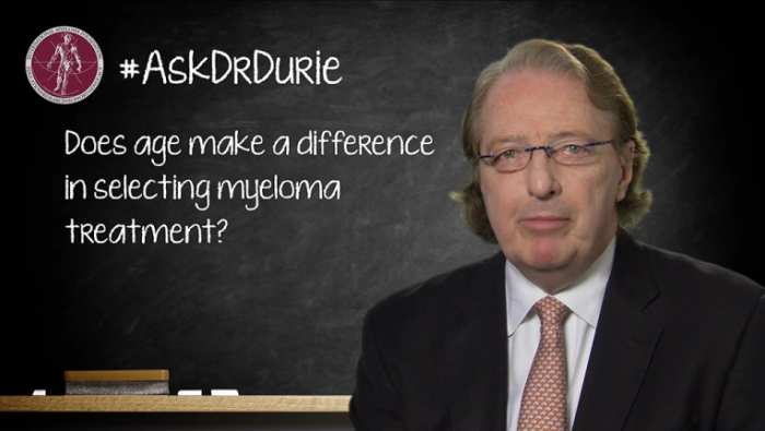 Dr. Durie in front of a chalk board