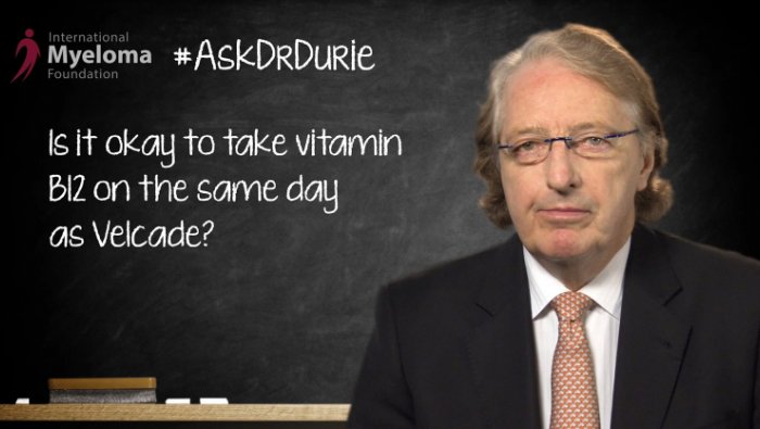 Dr. Durie in front of a chalk board