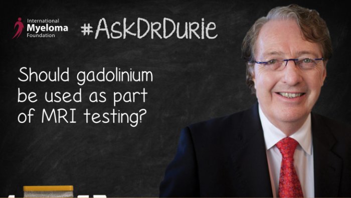 Dr. Durie in front of a chalk board