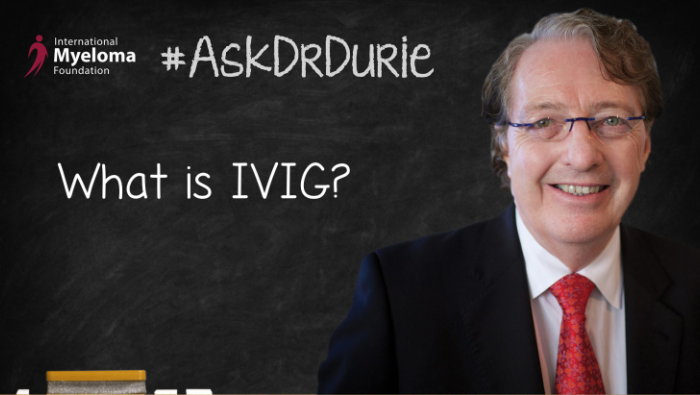 Dr. Durie in front of a chalk board.
