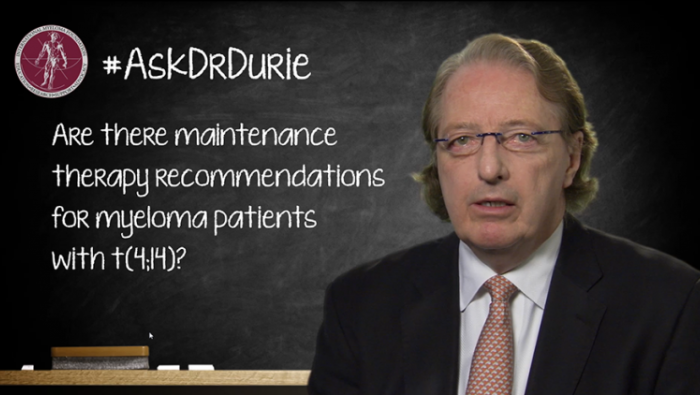 Dr. Durie in front of a chalk board