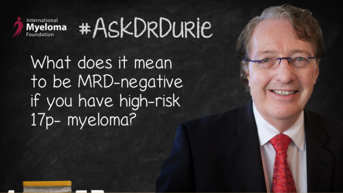 Dr. Durie in front of a chalk board
