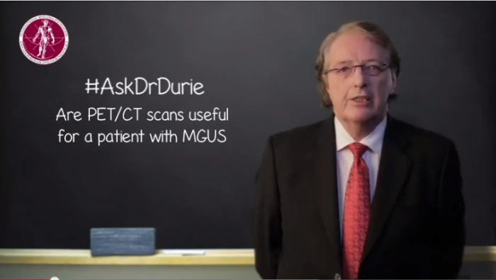 Dr. Durie in front of a chalk board