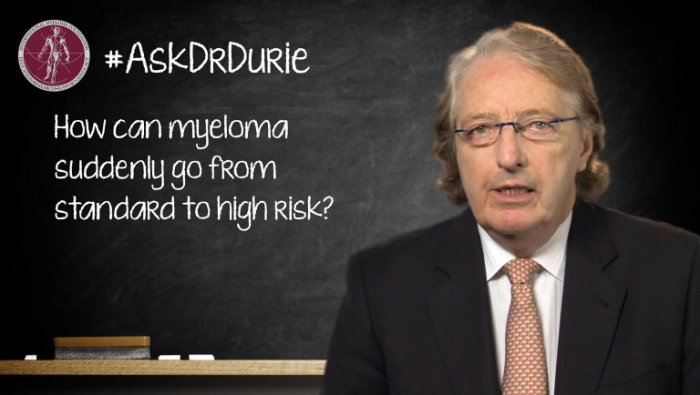 Dr. Durie in front of a chalk board
