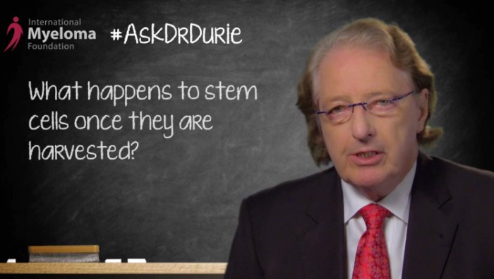 Dr. Durie in front of a chalk board