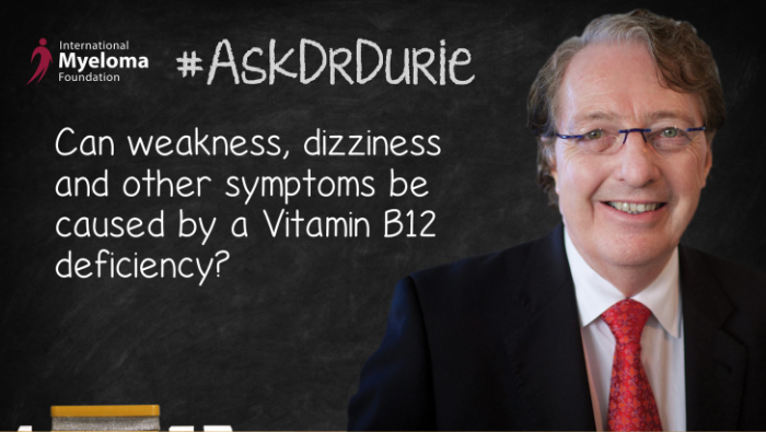 Dr. Durie in front of a chalk board