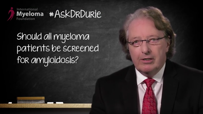 Dr. Brian G.M. Durie photo on backdrop of chalkboard with text overlay, "Should all myeloma patients be screened for amyloidosis?"