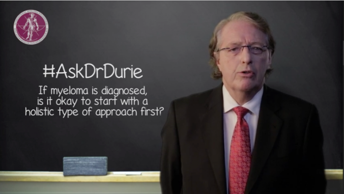 Dr. Durie headshot in front of chalk board