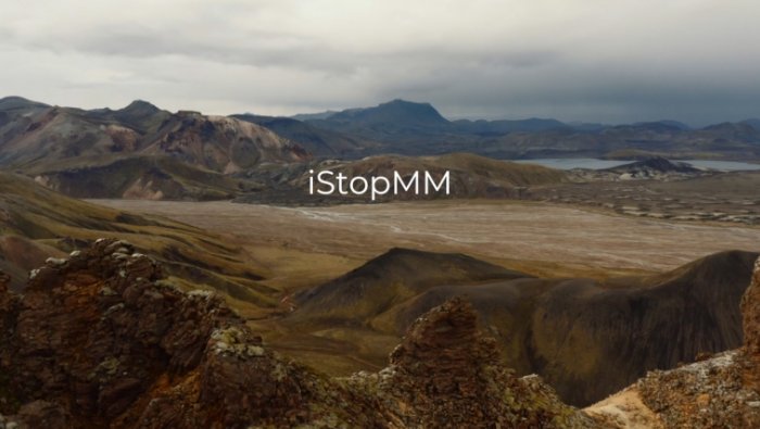 iStopMM 2 text overlaid on image of a valley